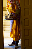Woman Entering Room With Traditional Mint Tea, Morocco