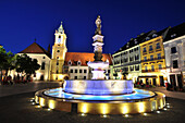 Marketplace with illuminated fountain and old town hall in the evening, old town of Bratislava, Slovakia, Europe