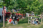 People resting in James Simon Park, Middle, Berlin, Germany