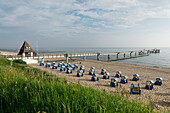 Beach with canopied beach chairs and pier, Baltic Sea, Seaside Resort of Koserow, Island of Usedom, Mecklenburg-Western Pomerania, Germany