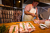 Butcher preparing lardo, Rifugio Agrituristico Salvin, Monastero di Lanzo, Piedmont, Italy
