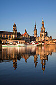 View over the Elbe river to Bruehlsche Terrasse, Staendehaus, Dresden castle and church Hofkirche in the evening light, Dresden, Saxonia, Germany