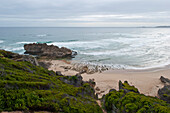 Beach and rocks under clouded sky, Brenton on rocks, Garden Route, South Africa