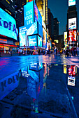 People at Times Square at night, Manhattan, New York, USA, America