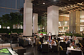 People having their dinner at the terrace of the outdoor restaurant, Millennium Hilton Hotel, Bangkok, Thailand