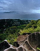 Granitic rock on the way to Nid d'Aigles lookout point in 300m above sealevel, view over the village La Passe and Praslin Island, central La Digue, La Digue and Inner Islands, Republic of Seychelles, Indian Ocean
