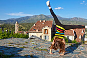 Child playing in the Oberstadt, Corte, Corsica, France