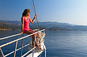 Woman on sailing boat at lykian coast, Mediterranean Sea, Turkey, Europe
