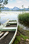 Boat at lakeshore of lake Hopfensee, Fuessen, Allgaeu, Bavaria, Germany