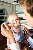 Father and son in kitchen, indoors