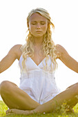 Young woman in yoga attitude