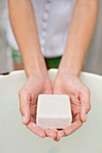 Woman washing hands with a soap