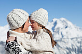 Mother and daughter hugging