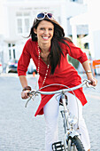 Portrait of a beautiful young woman cycling