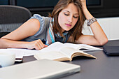 University student looking tired while studying