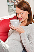 Young woman drinking coffee