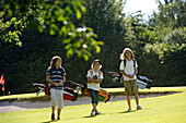 Children playing golf, Bergkramerhof, Bavaria, Germany