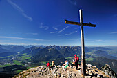 Cross at the summit of Sauling with view to Lech valley and Tannheimer mountain range, Ammergauer Alps, Oberallgaeu, Bavaria, Germany