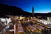 Christmas market in front of Bolzano cathedral in the evening, Bolzano, South Tyrol, Alto Adige, Italy, Europe