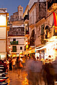 People In Alleys At Dusk With Santa Maria Cathedral On Hill Behind, Ibiza Town, Ibiza, Spain