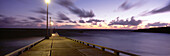 Pier and coastline just before dawn, East Coast, Barbados