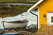 Boat and traditional house on Flaton Island, Bohuslan Islands, Bohuslan Coast, Sweden.