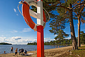 People enjoying the lakeside, Lake Malaren, Eskilstuna, Sweden.