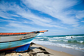 Small striped fishing boat on the beach, Hammamet, Tunisia, North Africa