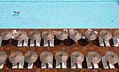 Man swimming in pool by sunloungers, Aerial View, Antalya, Turkey
