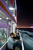 Ferry crossing the Bosphorus at night, Istanbul Turkey
