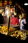 Corn vendor in the ground of the Sultanahmet (Blue) Mosque garden at night, Istanbul Turkey
