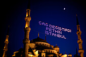 Blue Mosque at night with a lit sign, Sultanahmet, Istanbul, Turkey