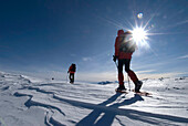 Italy, Piedmont, hikers with snow shoes