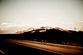 Shadow Covered Mountains Next to Highway, Nevada, USA