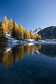 Reflection of mountains in Lake Palpuoga, Bergun, Grisons, Switzerland