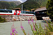 Train of the Glacier Express in Reckingen, Goms, Wallis, Valais, Switzerland