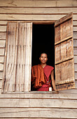 Buddhist monk in window, Wat Bo Temple, Siem Reap, Cambodia