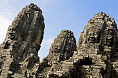 Some of the  216 giant faces of Avalokiteshvara, Giant faces watch over visitors in the temple of Bayon. Temples of Angkor, Siem Reap, Cambodia.