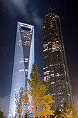 Low angle view of the World Financial Building, next to Jin Mao Building, at night. Shanghai, China, Shanghai, China.