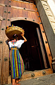 Maya girl in church doorway, Anigua, Guatemala