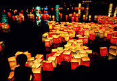 Lanterns with candles place on Motoyasu River, Peace Park, Buddhist ceremony for dead souls held on 6th August, the anniversary of bombings at Hiroshima, Hiroshima, Japan"