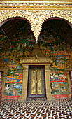 Doorway of ornate gilded wat, Luang Prabang, Laos