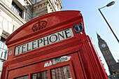 Red telephone box on Parliament Square with Big Ben in background, London, England