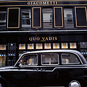 Giacometti Quo Vadis and black cab, Soho, London.