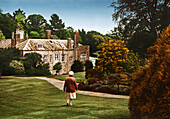 Old woman in front of manor house Prideaux Place, Padstow, Cornwall, Southern England, Great Britain, Europe