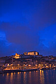 Oporto viewed at dusk from cruise, Douro valley, Portugal