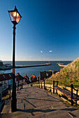 Steps leading to town and harbor, Whitby, North Yorkshire, England, UK