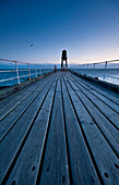 Pier at dawn, Whitby, North Yorkshire, England.