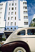 Old White car, art deco building, Miami, Florida, USA  
