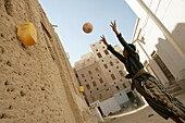 Boy playing basketball in Shibam, Hadramawt valley, Yemen